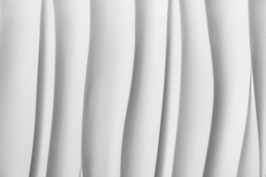 Decorative relief wave texture for walls. Gypsum 3D panels.