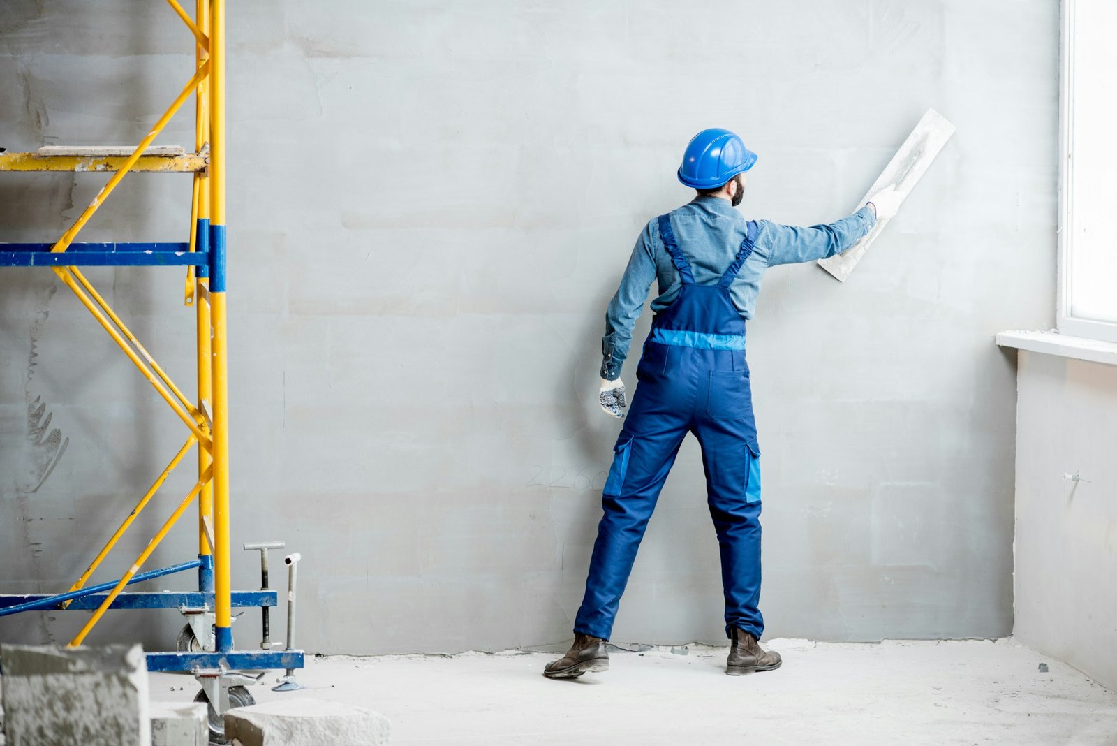 Plasterer working indoors